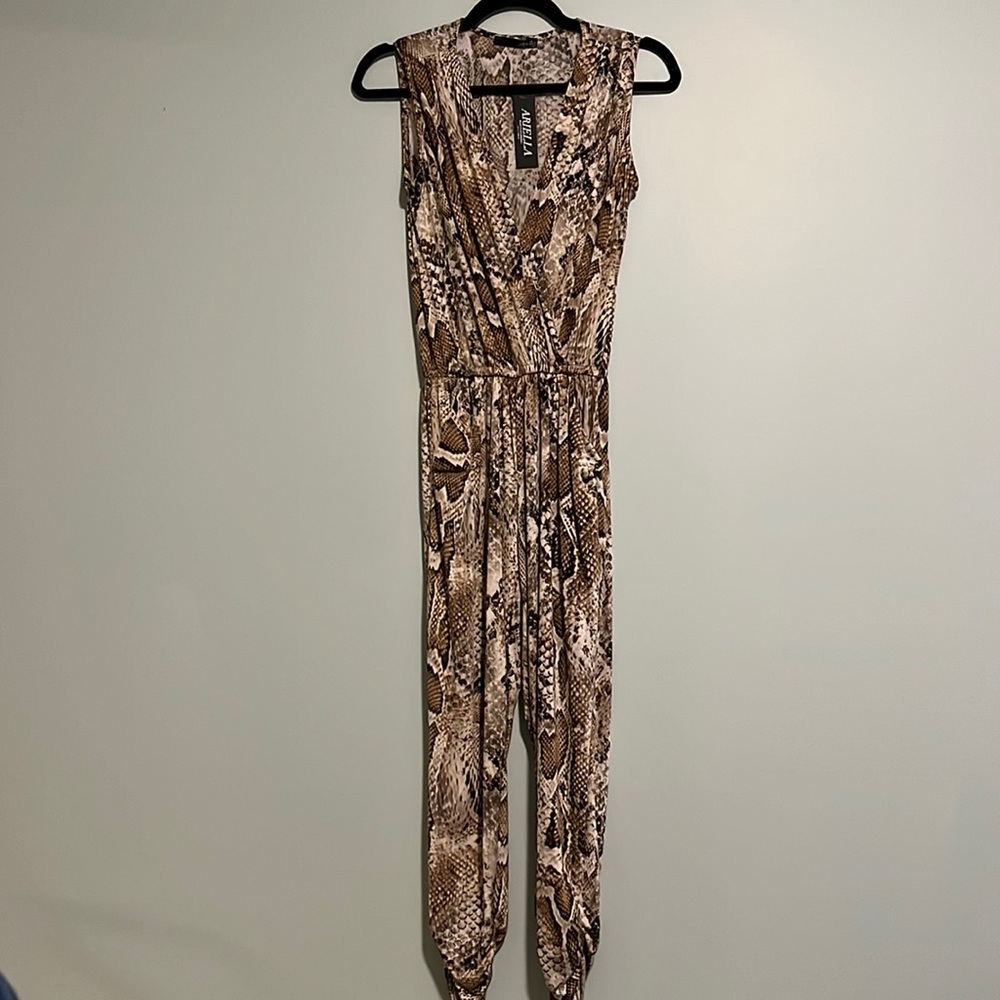 Arielle jumpsuit. Very stretchy material. Brown snakeskin. Small. NWT